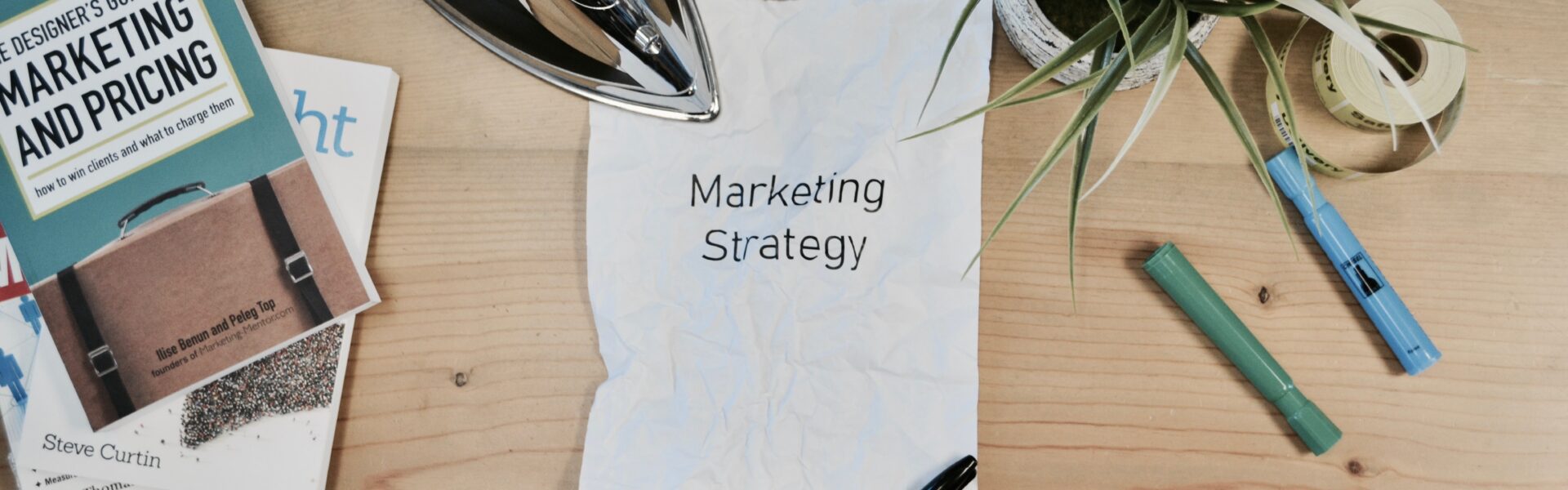 Desk showing work on developing a marketing strategy