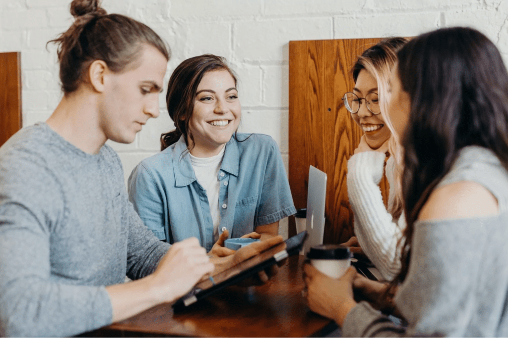 Group of colleagues chatting around a table