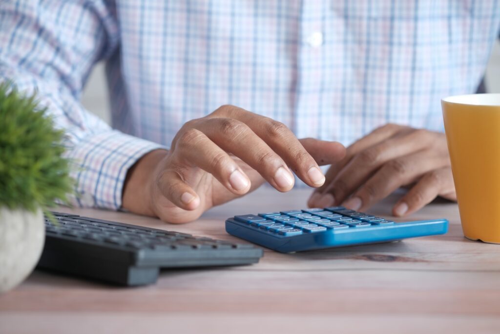 Man using a calculator