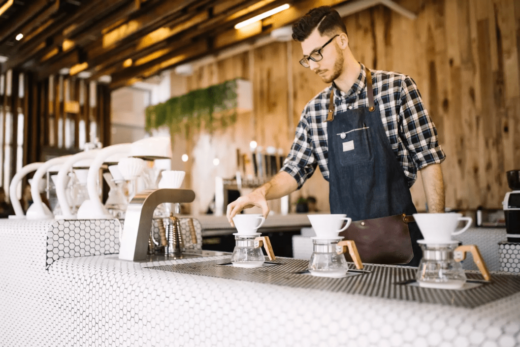 Barista serving up coffee pour-overs