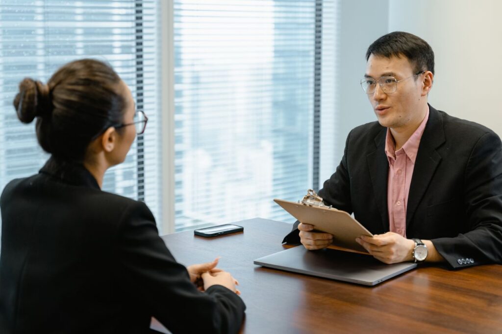 HR professional interviewing candidate with resume